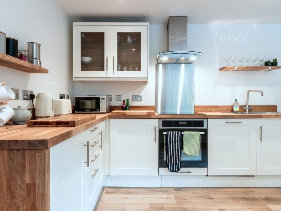 Kitchen, Countertop, Kitchen Appliance, Furniture, Cabinetry, Major Appliance, Flooring, Wood, Interior Design, Home Appliance