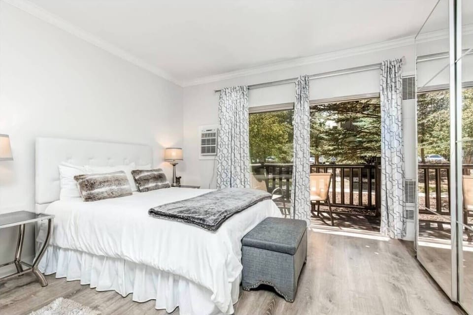Wake up refreshed in your airy bedroom, where natural light filters through elegant curtains and sliding doors open to your private balcony retreat.