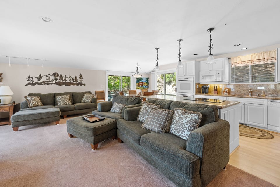Living Room with Lake Views - Living Room with Lake Views, comfy sweating, open floor plan, patio access, and smart TV!