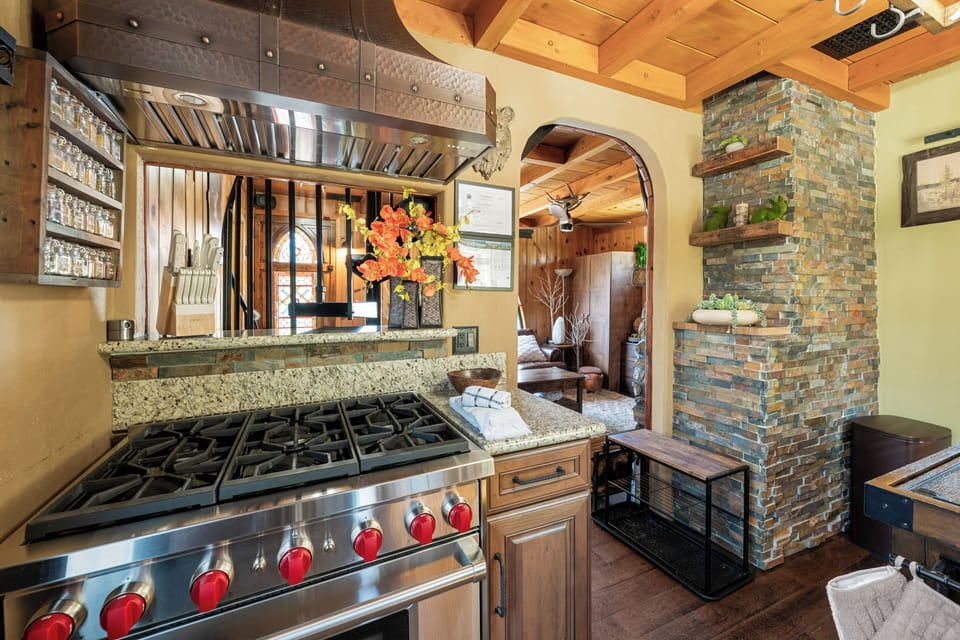 Kitchen - Full Kitchen with outdoor BBQ – Propane, Wolf Range Stove/Oven, Dishwasher, Microwave, Frigidaire Fridge, K-Cup Coffee Maker, and Dishwasher