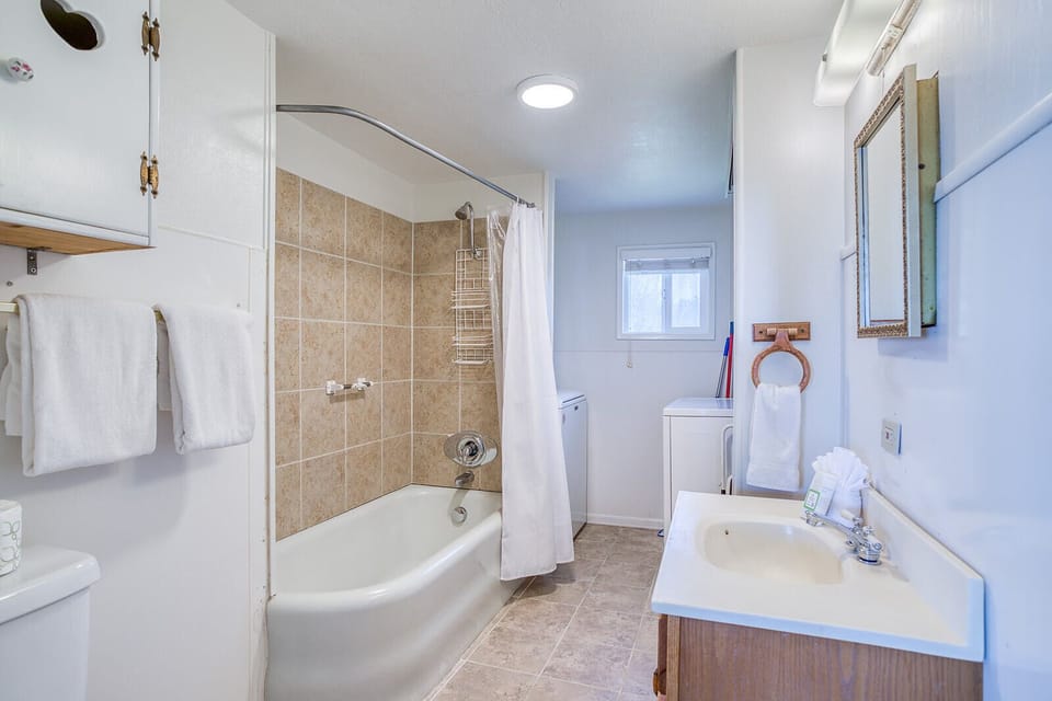 Refresh in your private bathroom with tiled shower-tub combo, fresh towels, and thoughtful amenities awaiting your arrival.