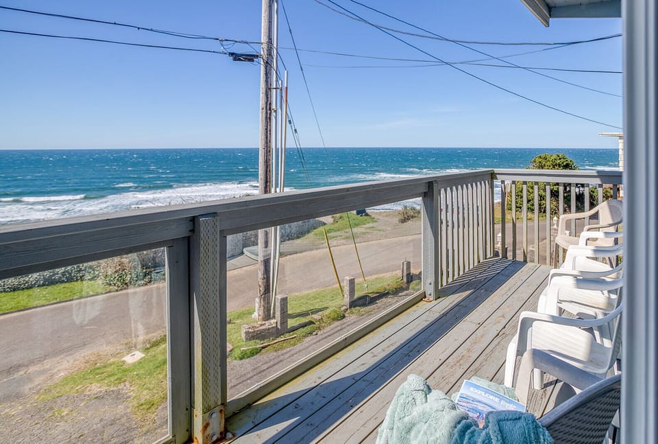 Your private balcony offers the perfect seaside retreat where you can relax with coffee while watching waves crash just steps away.