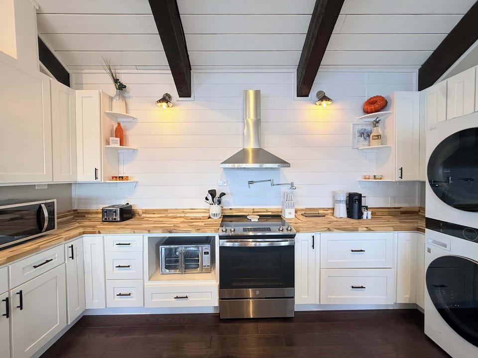 The breezy kitchen offers ample space & all the comforts of home​