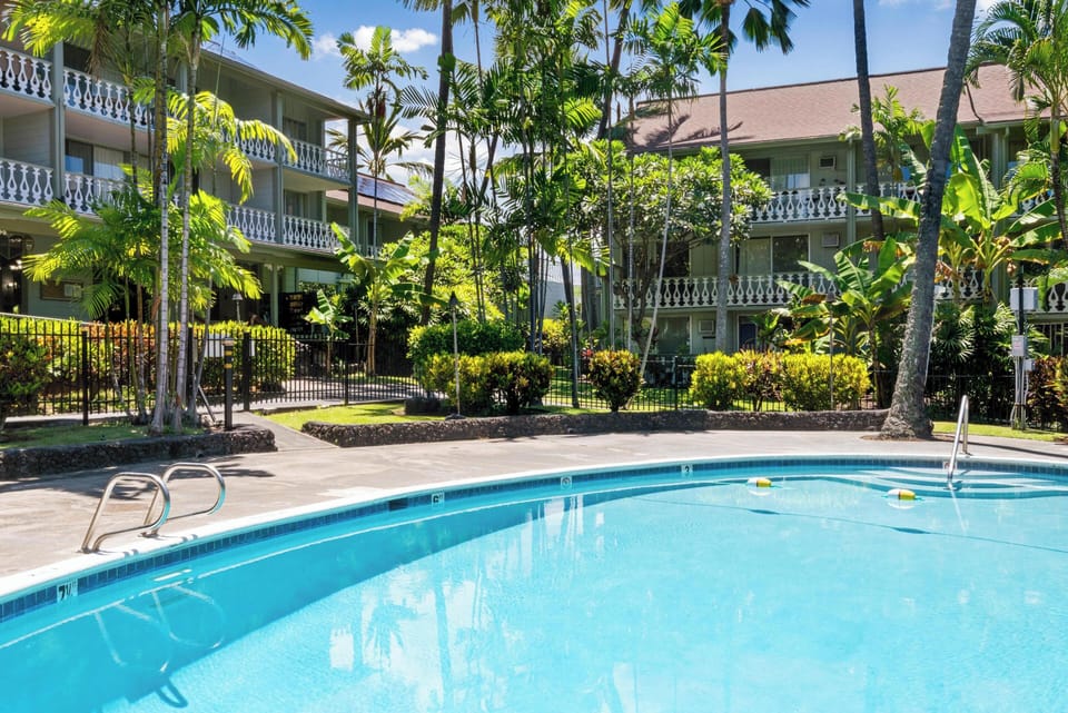 Take a refreshing dip in your private pool surrounded by swaying palms and tropical gardens.