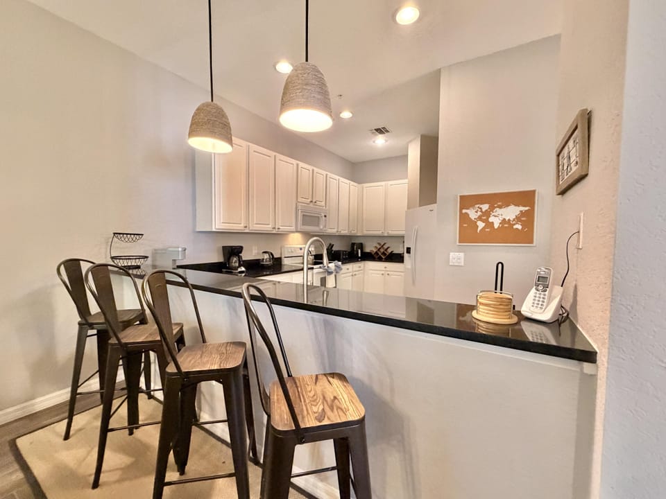 Breakfast bar attached to kitchen.