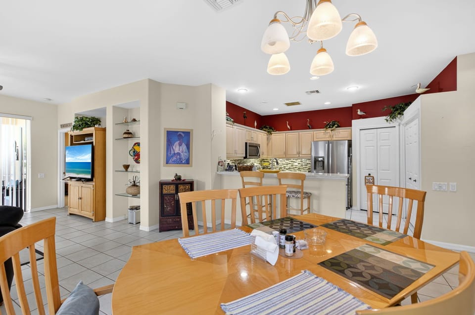 Spacious dining area flows into the kitchen.