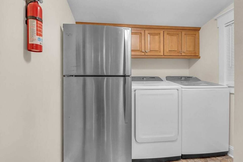 Laundry room has full-size washer and dryer and 2nd full-size fridge to store extra food and beverages