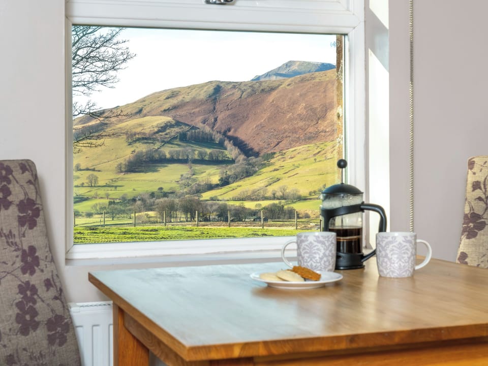 Inviting dining room with picturesque views | Sharp Edge, Mungrisdale, near Keswick