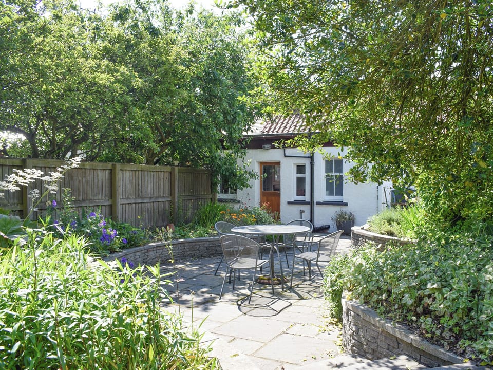 Attractive patio and garden | Kirkview Cottage, Upper Largo, near Leven