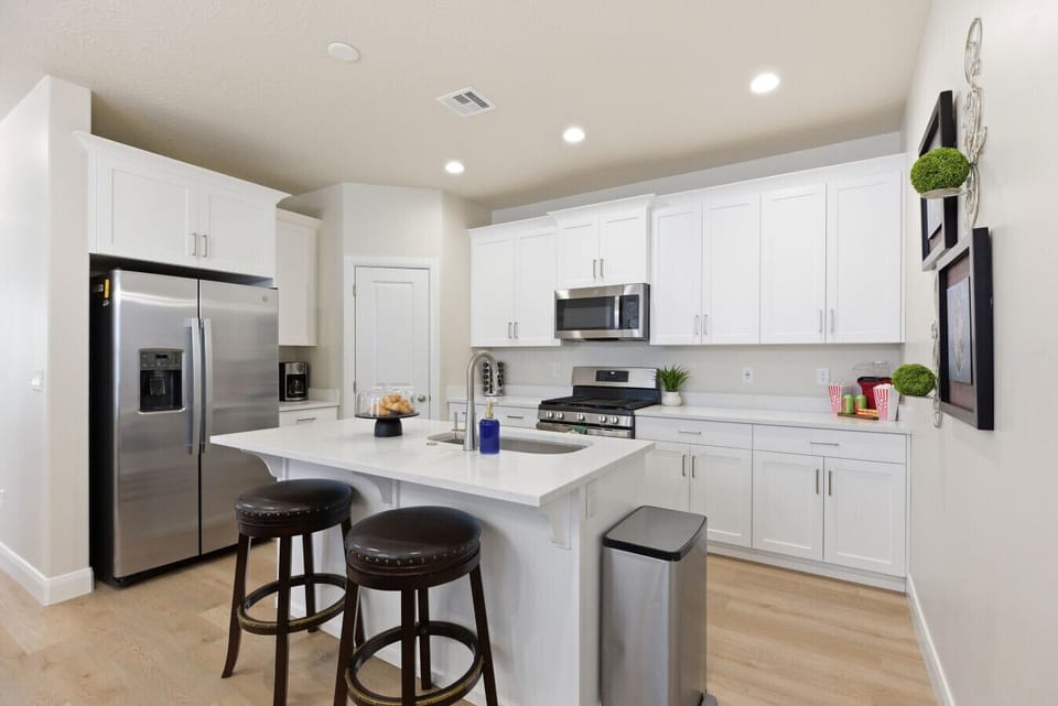 Kitchen: Whip up culinary delights in this sleek, modern kitchen with inviting seating!