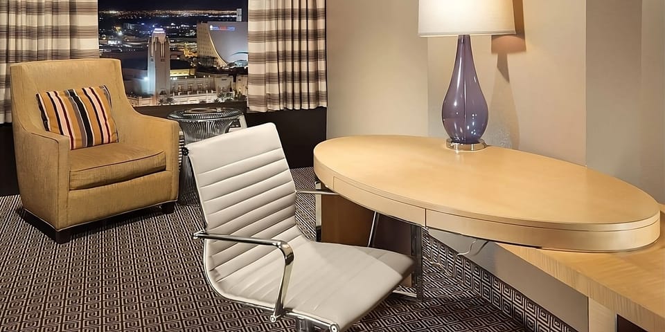 Settle in with a roomy desk and cozy lounge chair.