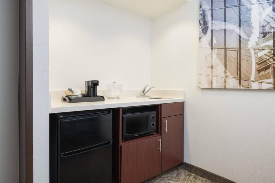 Start mornings easy with microwave, sink, and mini-fridge.