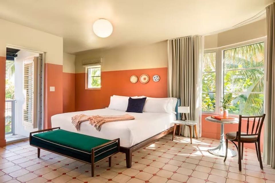 Start mornings with sunshine, patio doors, and garden greenery.