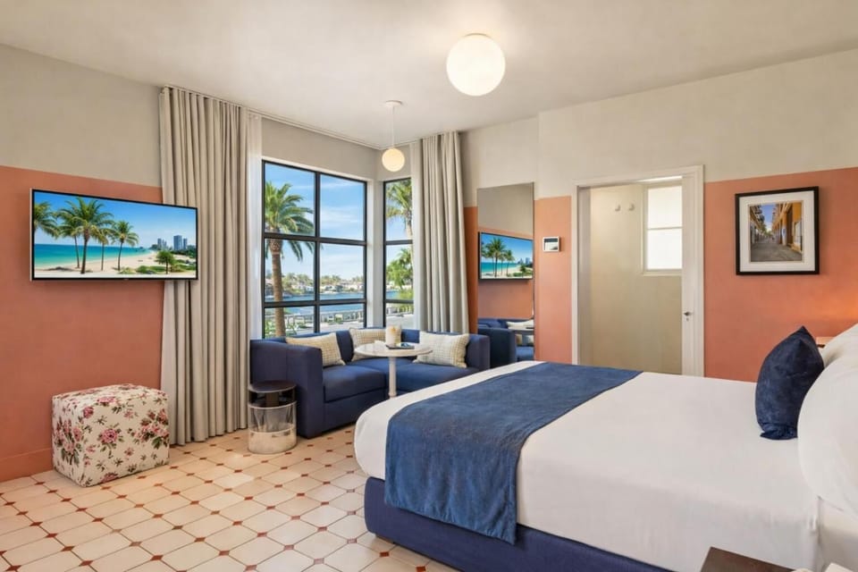 Relax in a spacious suite with sofa and palm views.