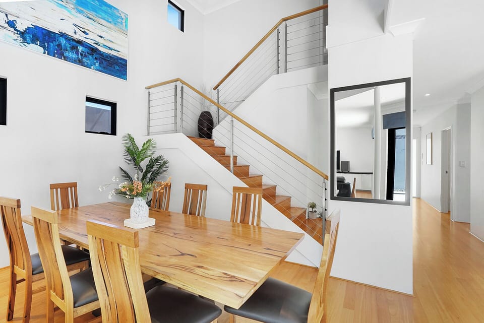 Architect-designed staircase and mezzanine overlooking the main living space.