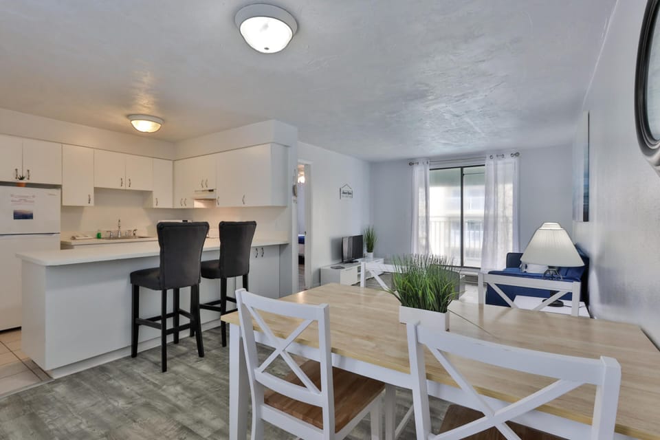 Bright open kitchen and dining area with cozy seating
