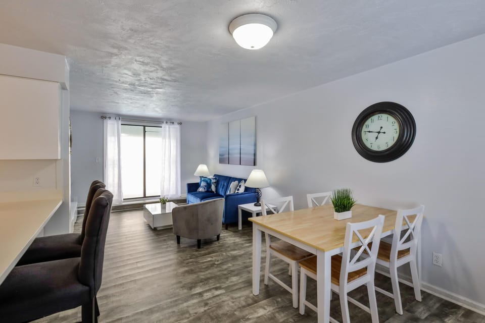 Bright and cozy dining and living area with natural light