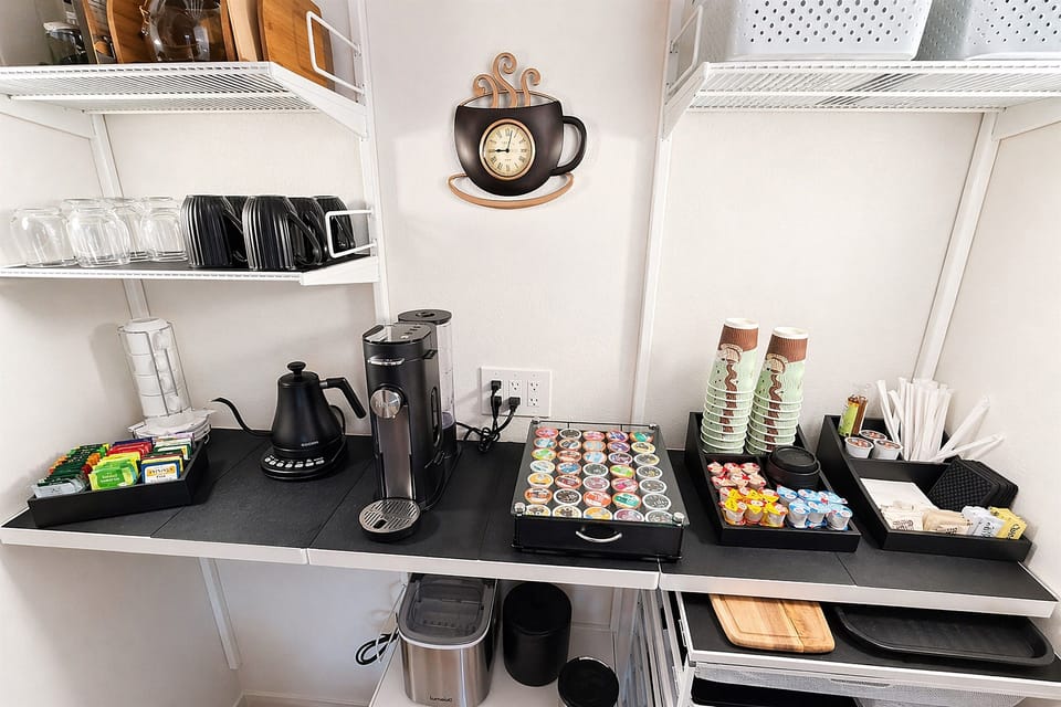 Coffee station with Keurig, complimentary coffee, tea, and supplies