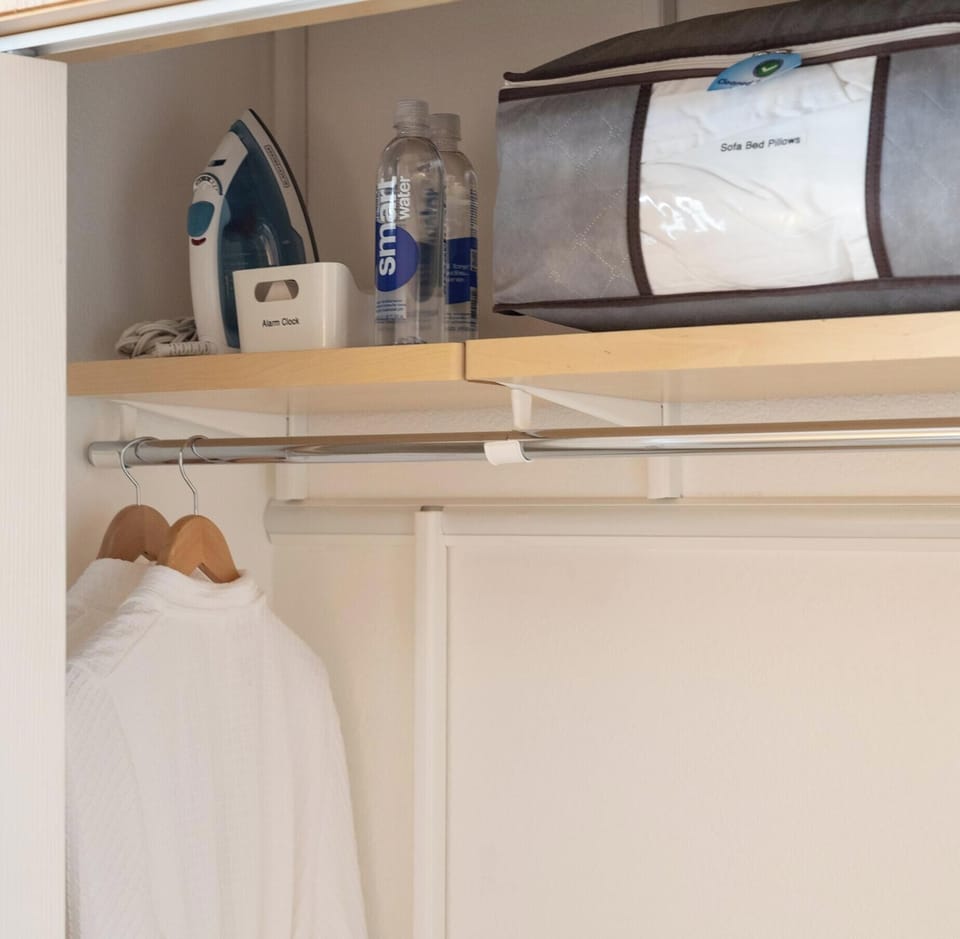 Closet includes robes, iron, and extra amenities for your stay