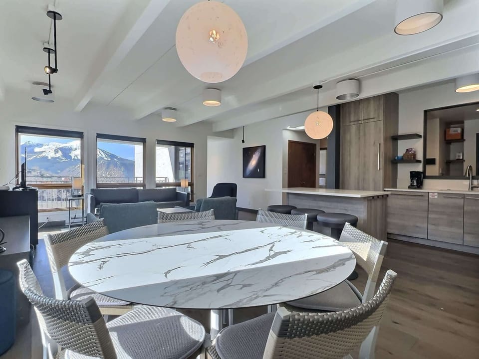 【Dining】Table for 6 next to the balcony doors — regroup for dinner after lifts close