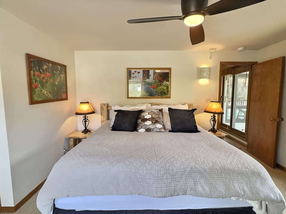 【Bedroom — Alt Angle】Wood-beam ceiling over the King — sleep well at 9,400 ft