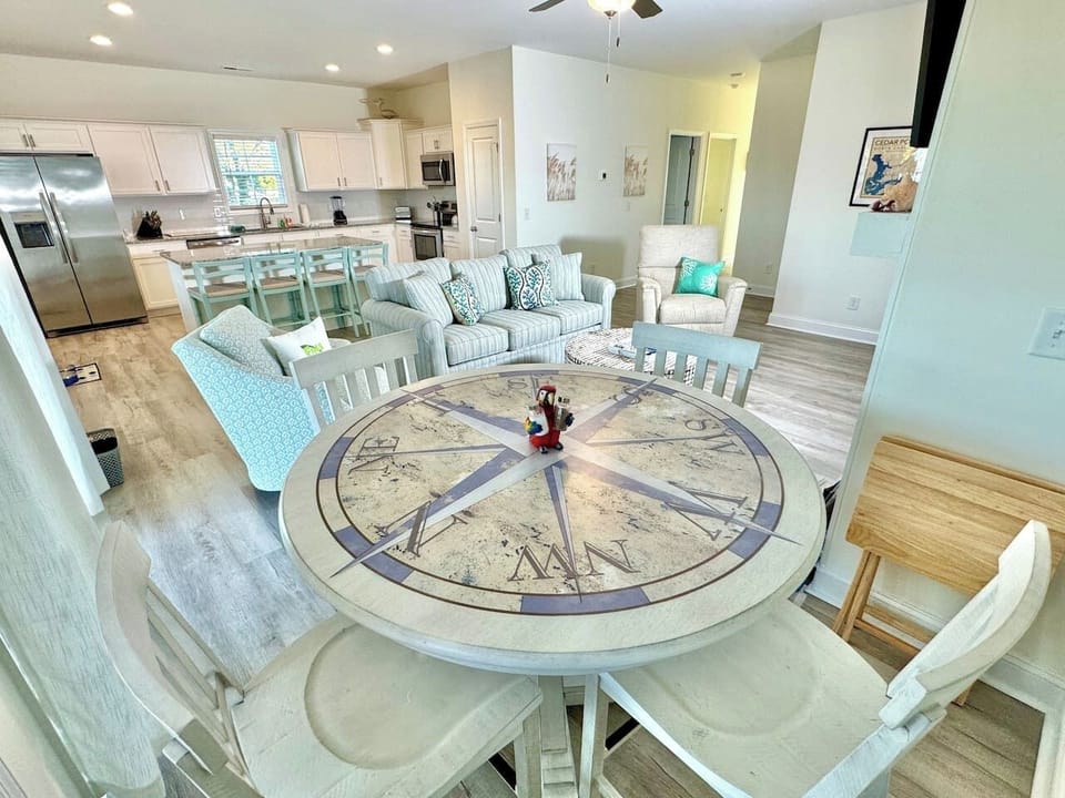Enjoy a meal with a water view at the compass-themed table or at the kitchen bar seating.