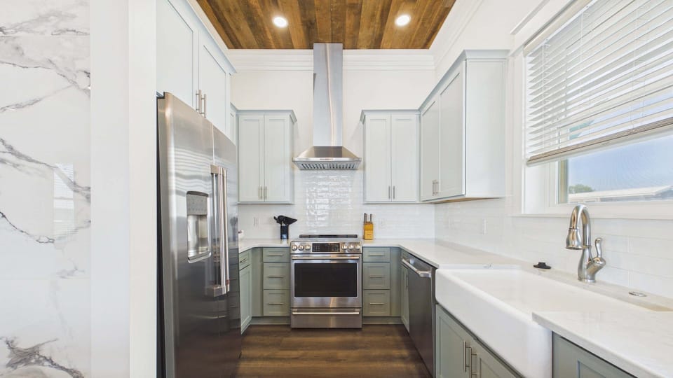2nd Floor: Kitchen equipped with stainless steel appliances while also featuring new finishings