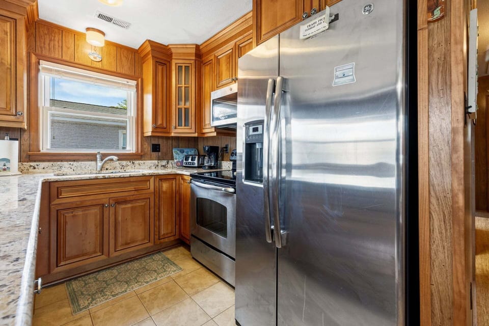 The modern kitchen is fully equipped for everything from quick breakfasts to family dinners.