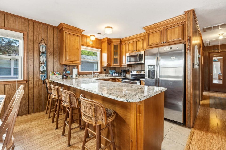 The modern kitchen is fully equipped for everything from quick breakfasts to family dinners.