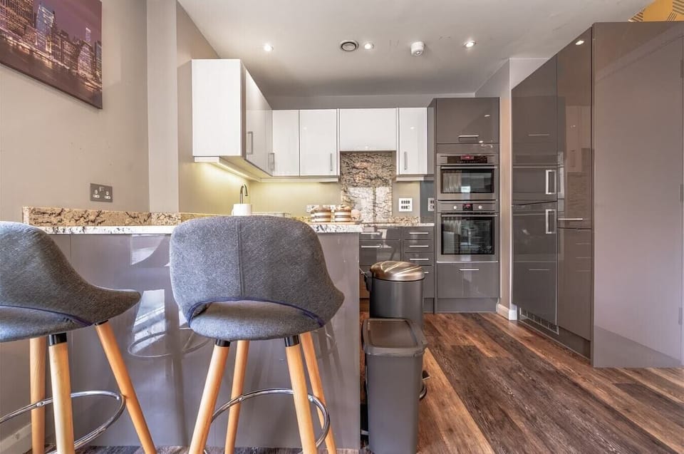 Fully equipped kitchen with island seating and appliances
