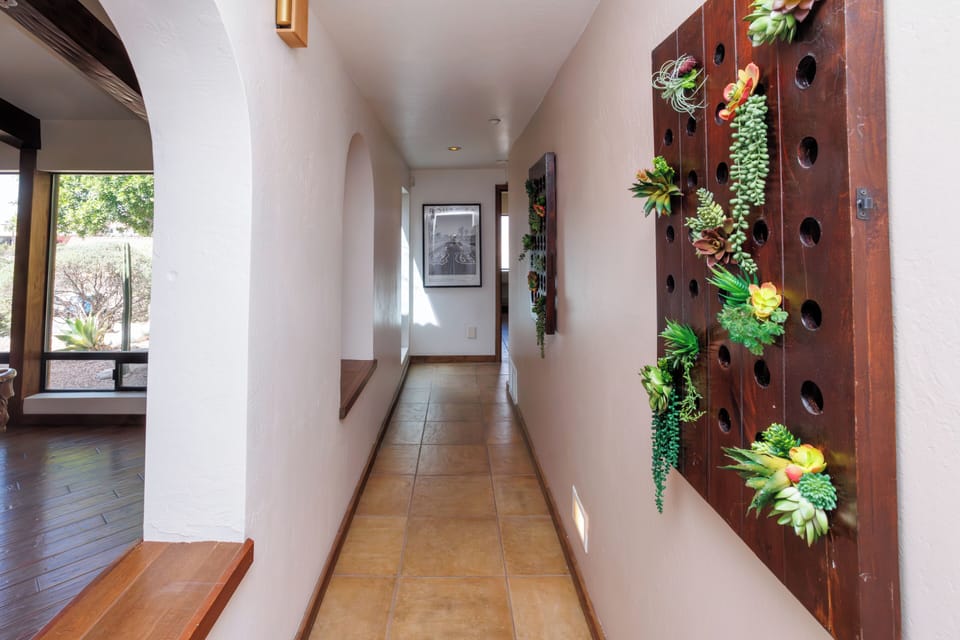 Hall runs along the side of the entertainment room.