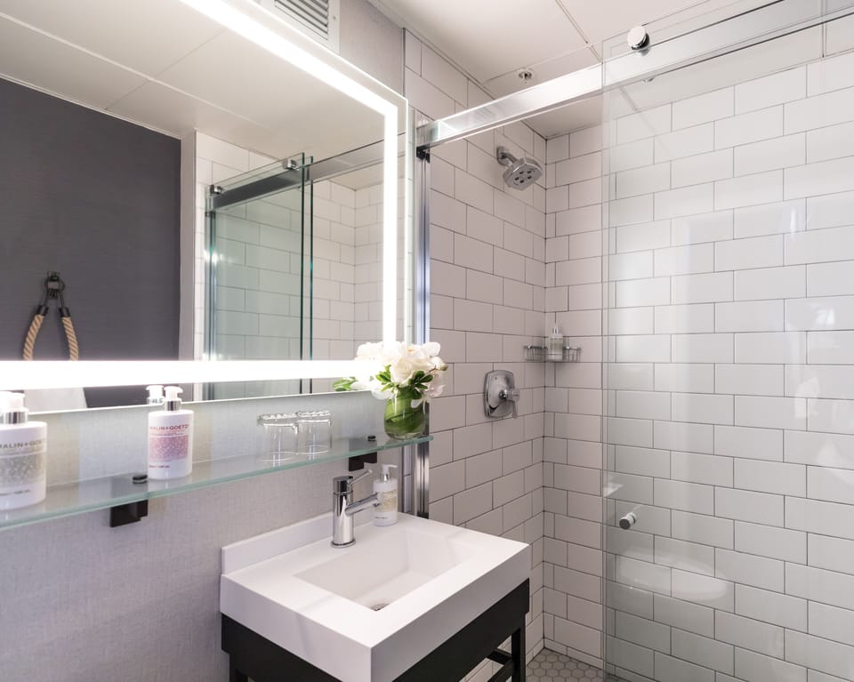 Rinse away the day beneath a rainfall shower in style