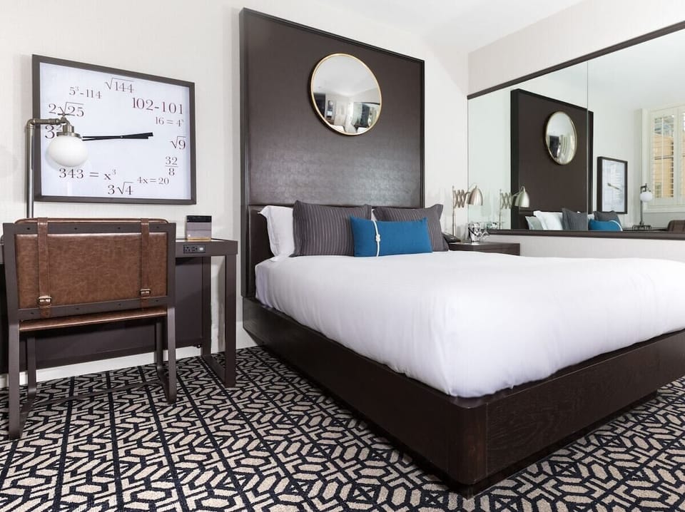 Unwind in a chic room with desk and luxe linens