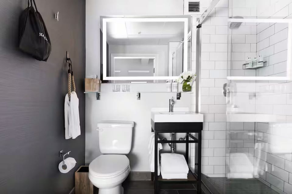 Start the day with a spotless vanity and glowing mirror light.