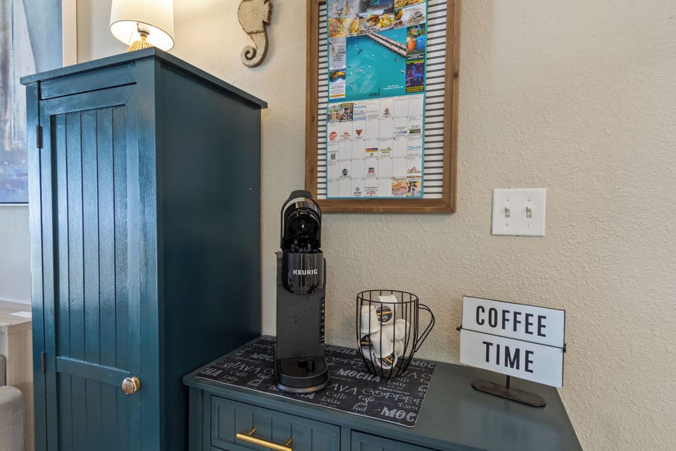 Start your mornings right at the dedicated coffee station, featuring a Keurig brewer and a "Coffee Time" sign to welcome the early riser.