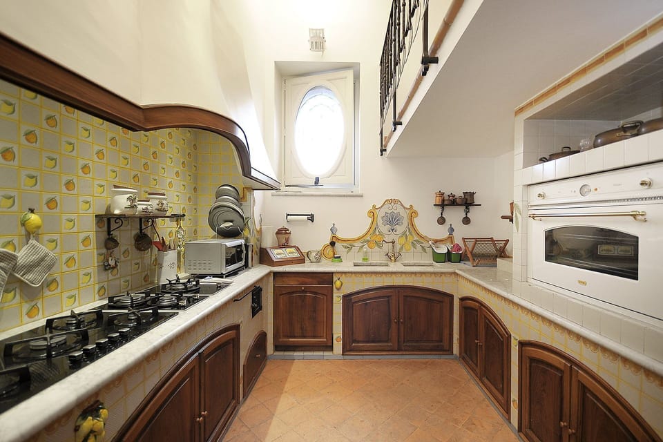 Kitchen, Interior Design, Countertop, Wood, Flooring, Furniture, Cabinetry, Kitchen Stove, Lighting, Floor