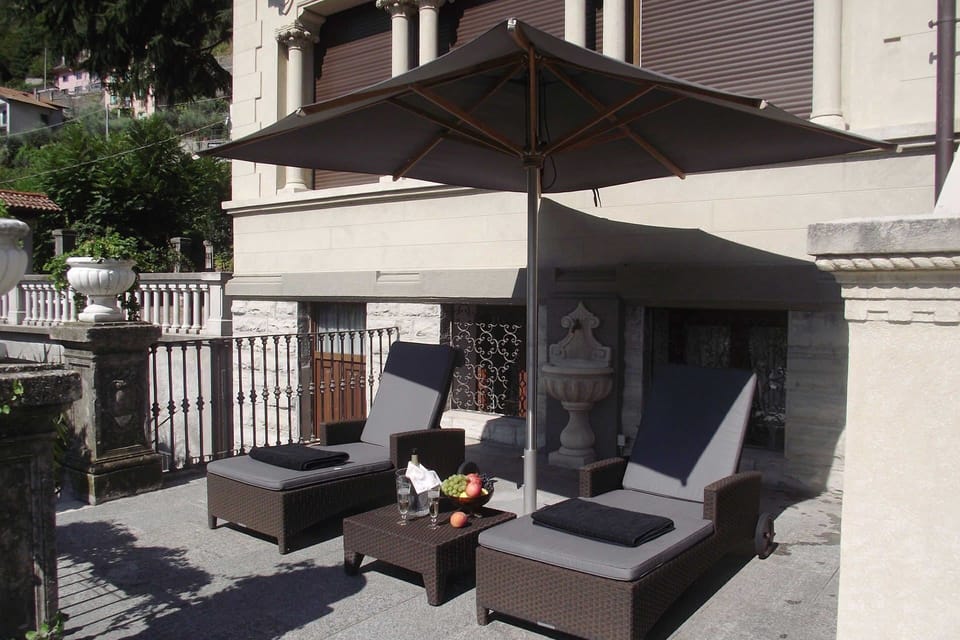 Furniture, Outdoor Furniture, Chair, Flowerpot, Umbrella, Outdoor Table, Houseplant, Shade, Patio, Balcony