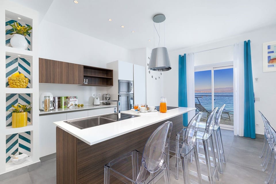 Furniture, Interior Design, Flooring, Kitchen, Floor, Wood, Countertop, Chair, Ceiling, Apartment