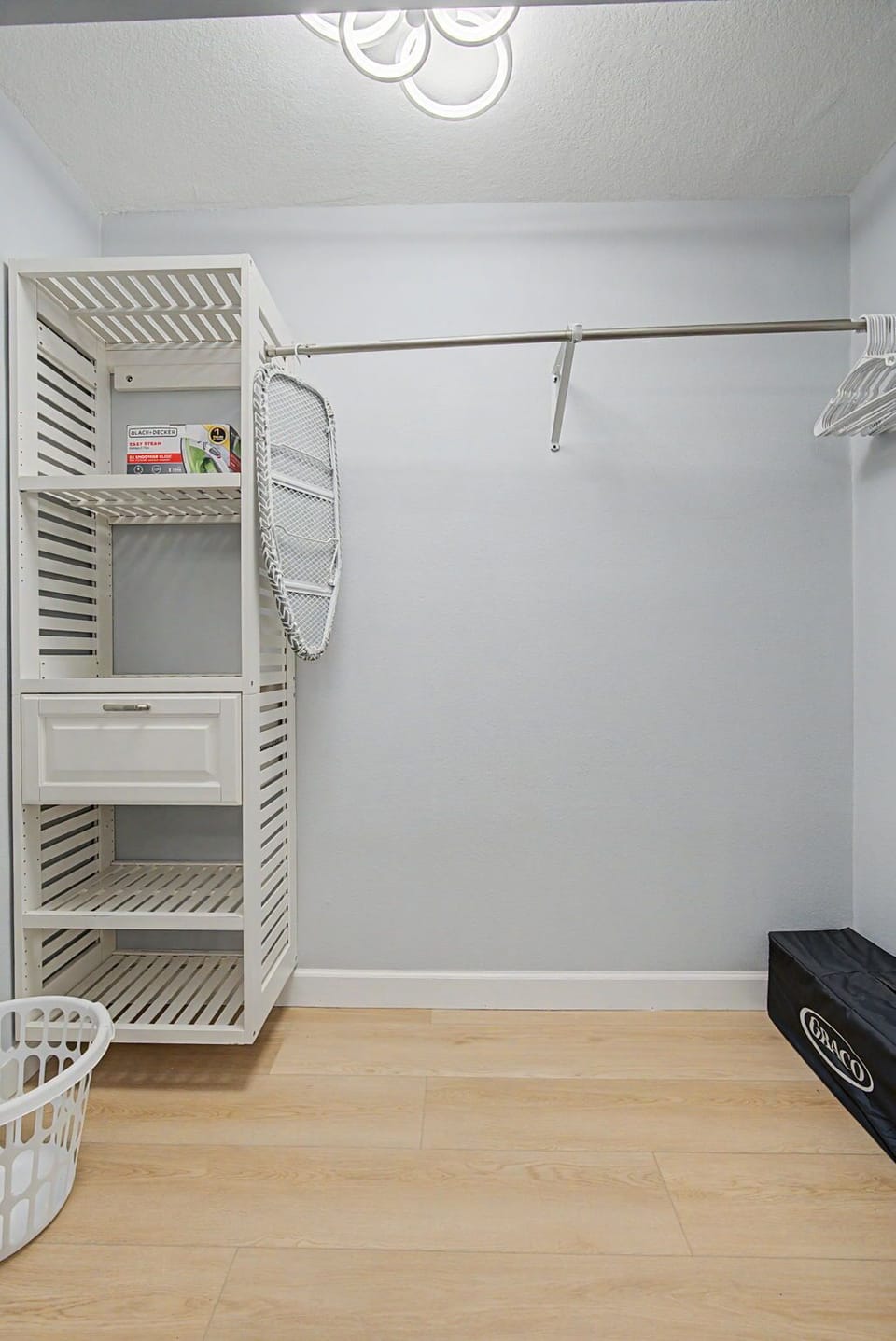 Your spacious walk-in closet features custom shelving and ample hanging space to keep all your belongings perfectly organized during your stay.