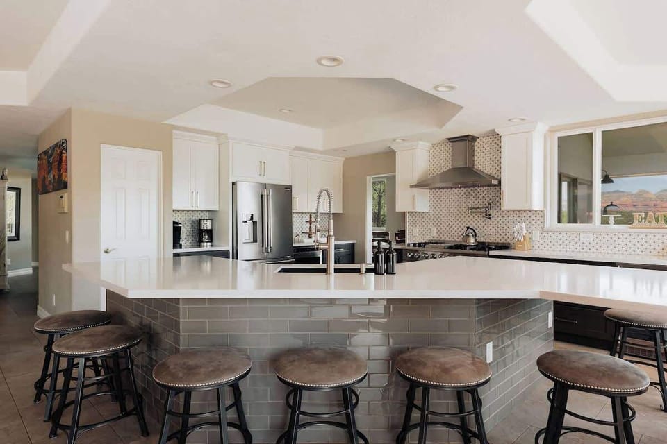 Your gourmet kitchen awaits with sleek countertops, stainless steel appliances, and a spacious island perfect for morning coffee or evening entertaining.
