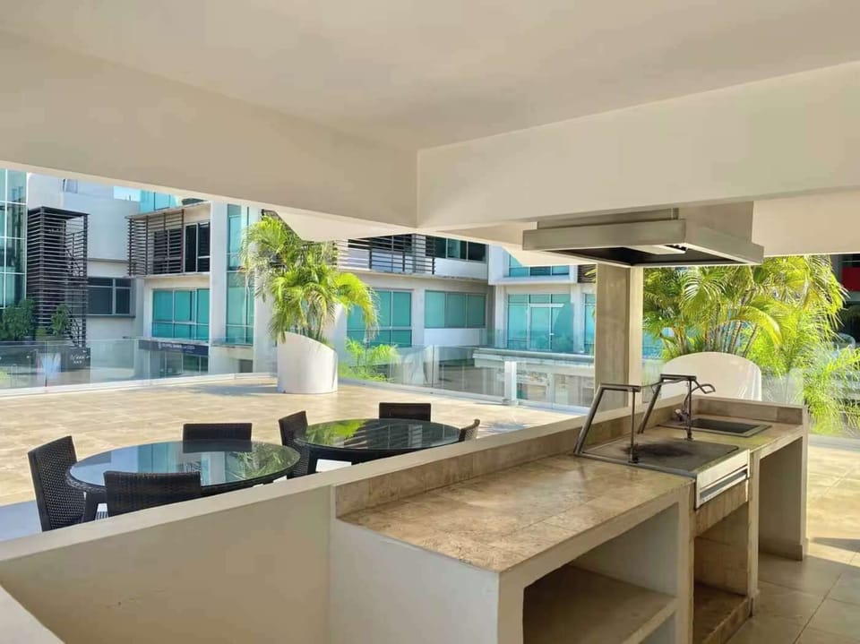 Shared outdoor kitchen & dining area perfect for casual meals