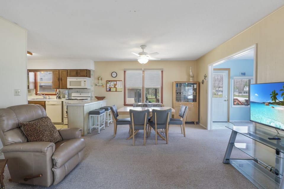 Settle into your spacious open-plan retreat with a fully equipped kitchen, cozy dining space, and entertainment center for perfect vacation comfort.