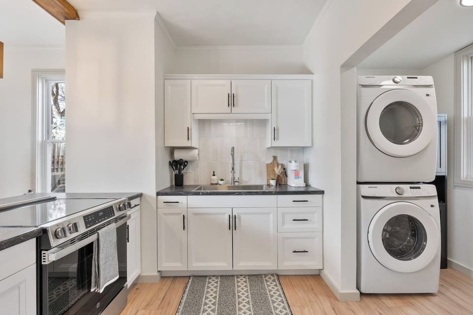 Fully remodeled kitchen with brand new clean laminate flooring, new appliances and over size sink.