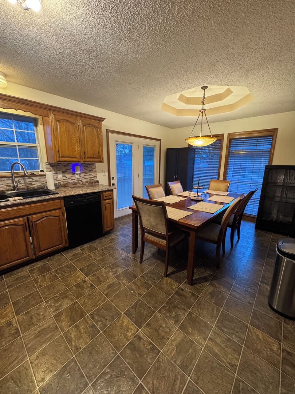 Kitchen/dining room area with back door access.