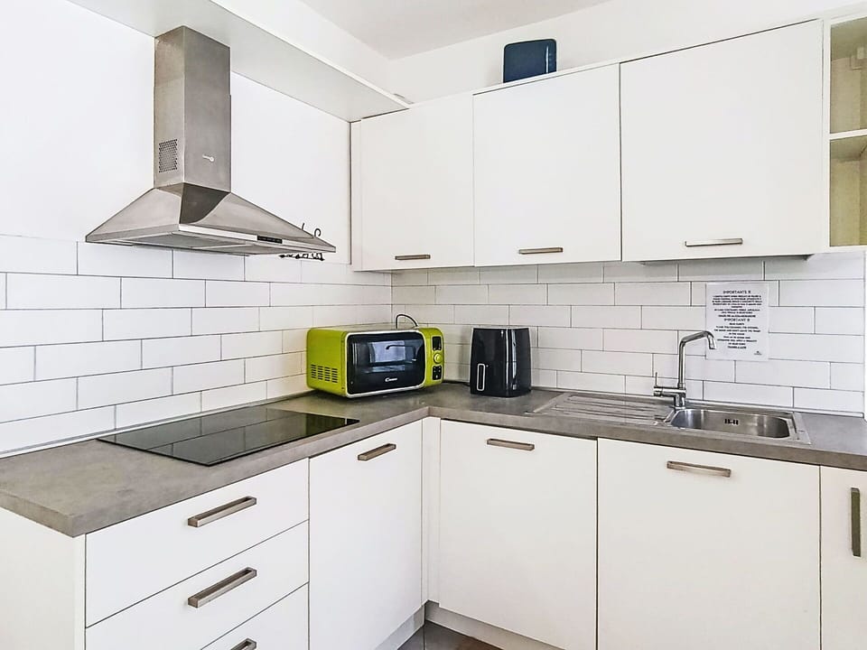 Kitchen, Kitchen Appliance, Countertop, Cabinetry, Major Appliance, Flooring, Interior Design, Furniture, Wood, Home Appliance