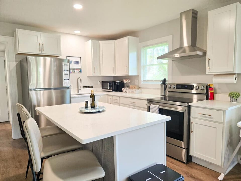 Cook with ease in a well-equipped kitchen with ample prep space and  electric oven