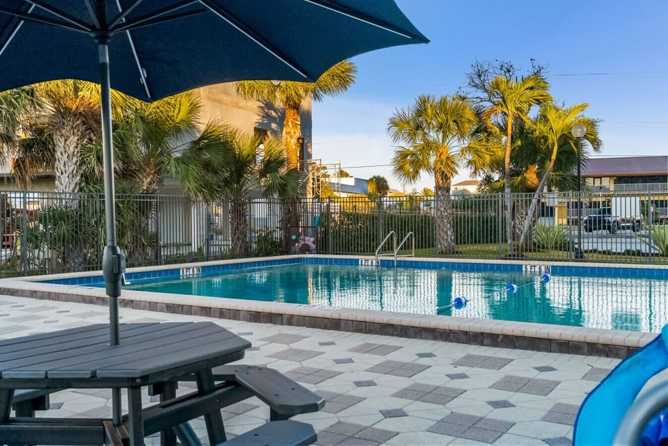 Large heated community pool with sundeck