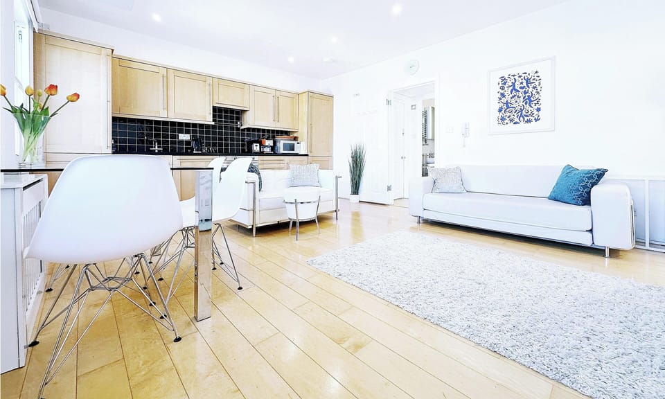 Large bright living with real wood Canadian maple floor