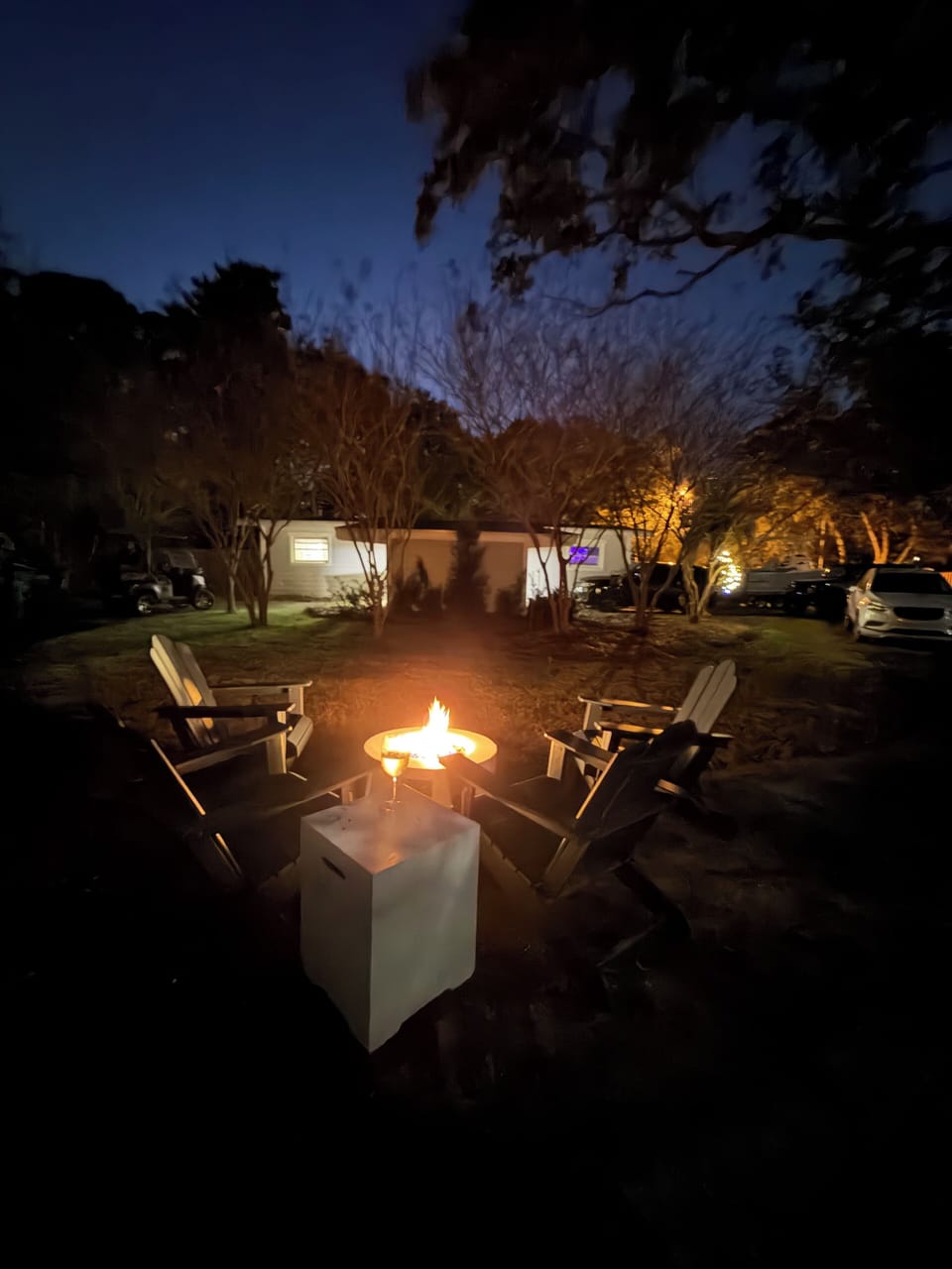 Outdoor seating with firepit. Projector and screen to project movies available.