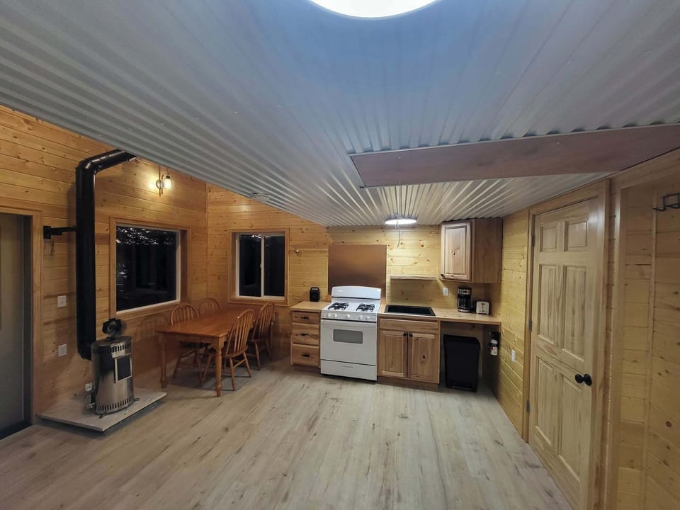 Table, Kitchen, stove, Sink ( but only has a 5 gallon bucket to catch water